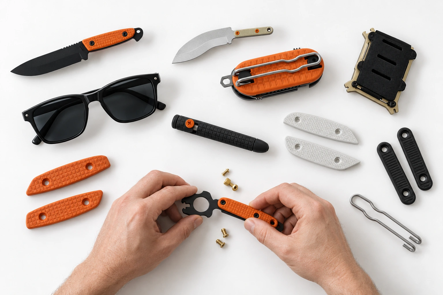 Turq Gear modular ecosystem arranged on a white tabletop, with two hands assembling a handle